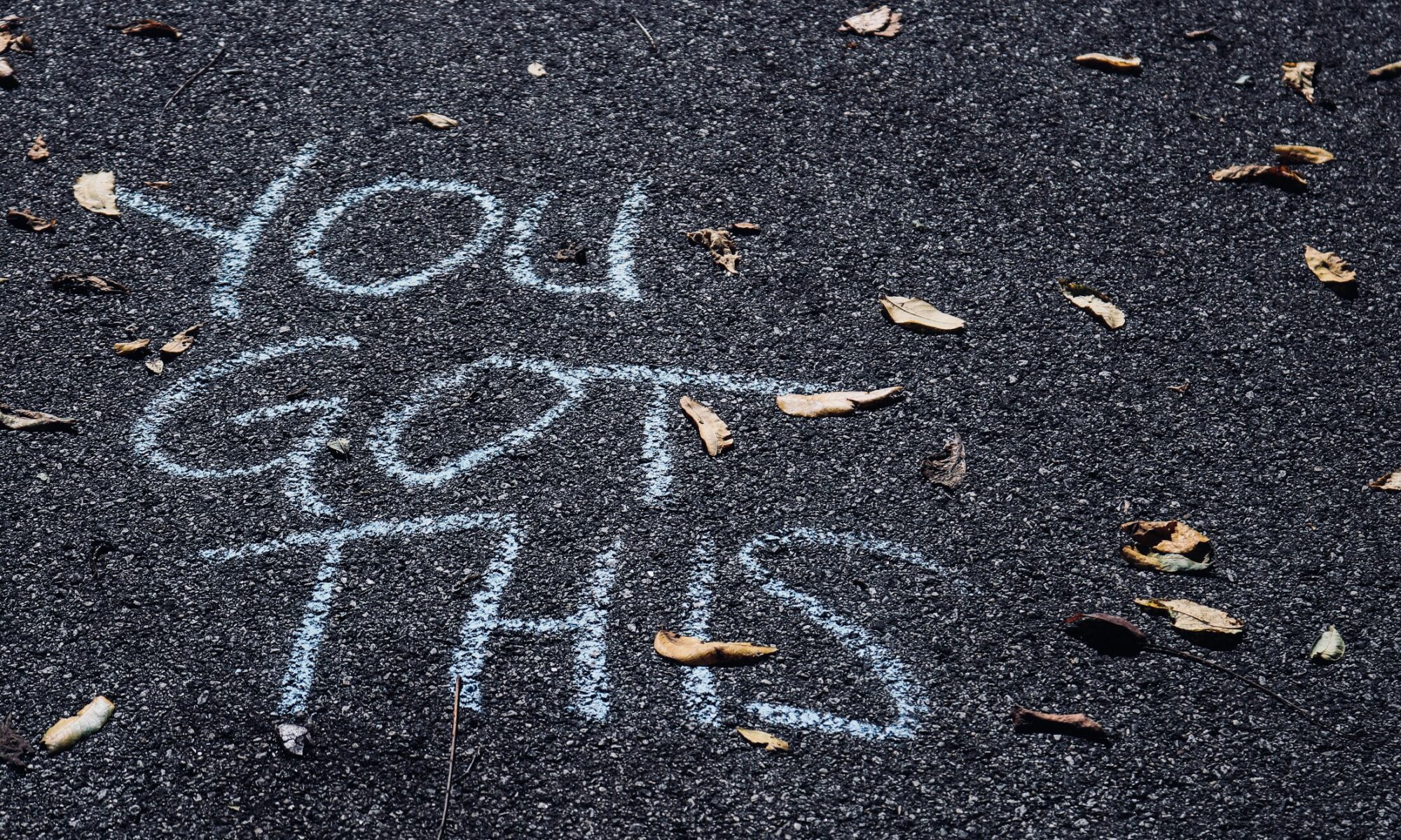 "You Got This" written in chalk on a road